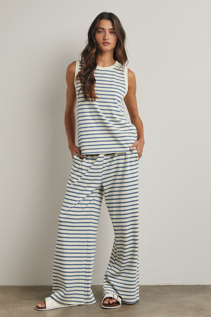 Blue + Cream striped set
Top is a tank with a high rounded collar
The bottoms contain an elastic waist and pockets 